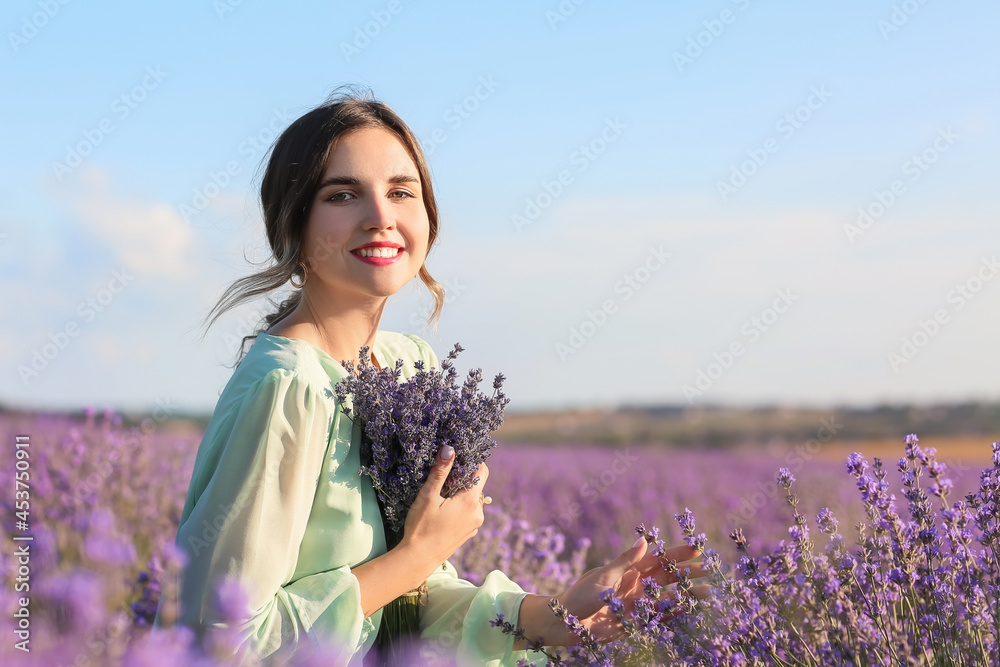 Beautiful young woman in lavender field