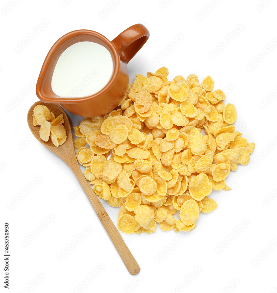 Tasty cornflakes and jug of milk on white background