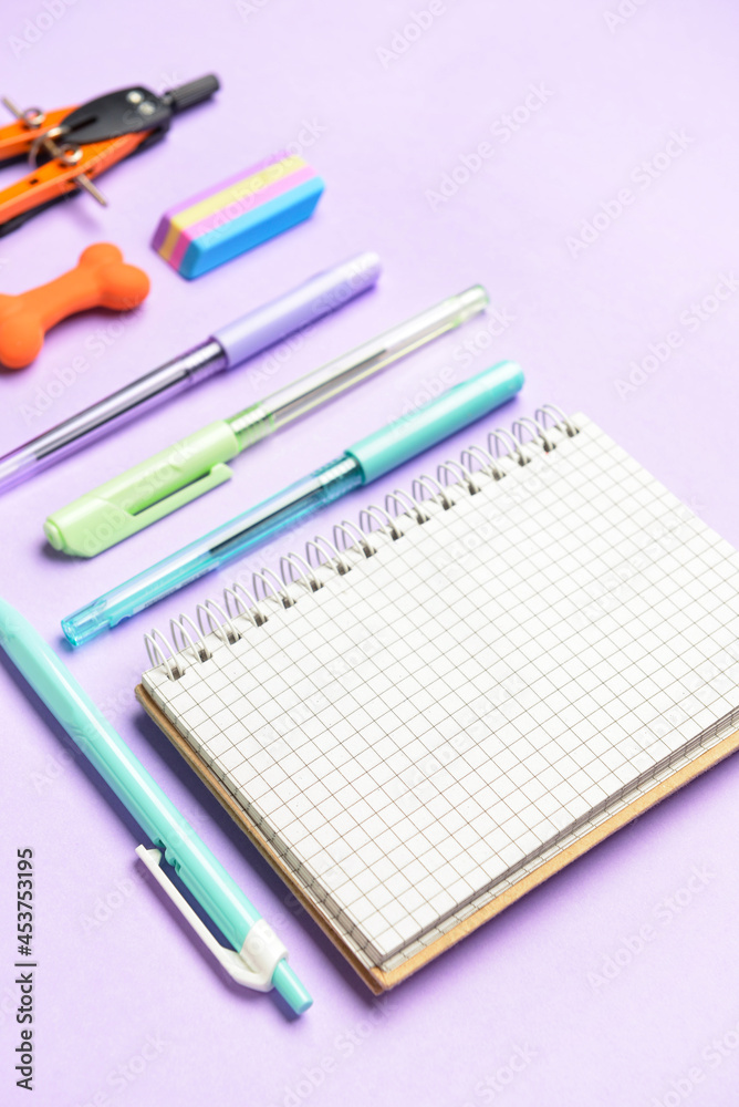 Stationery supplies on color background