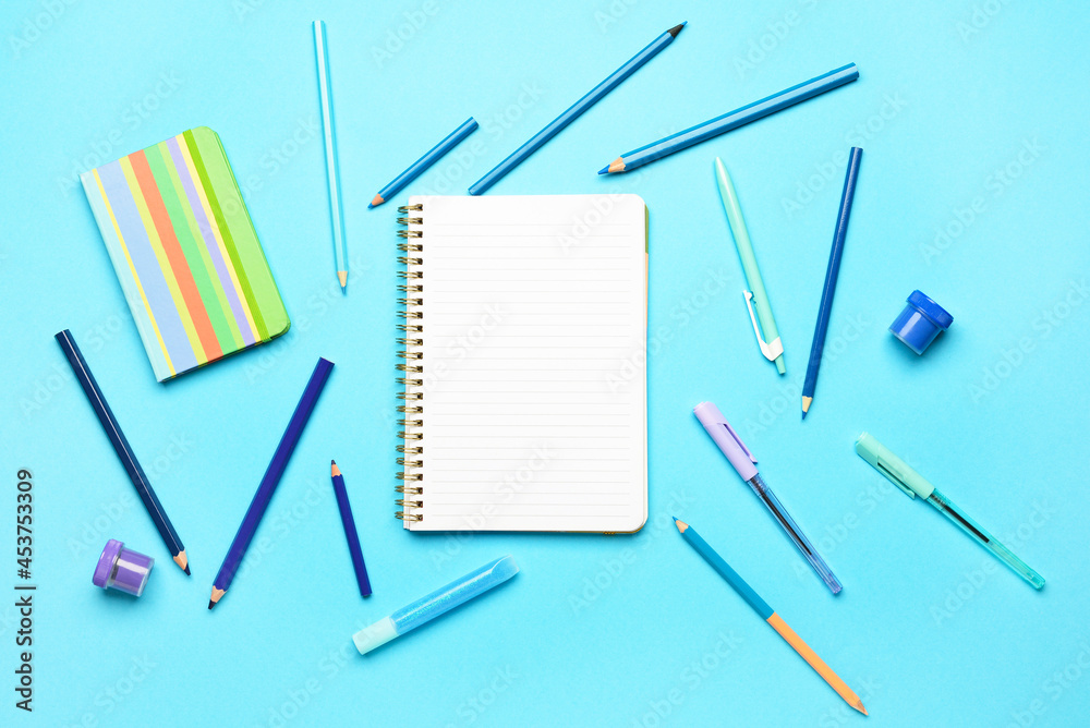 Stationery supplies on color background