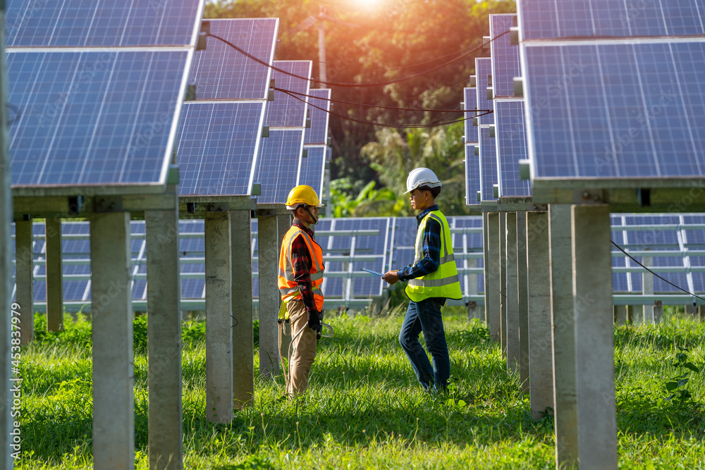 Engineer team working and installing solar panels at solar power plant,Innovative solution for energ