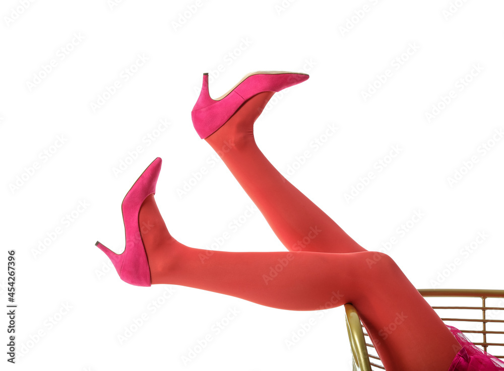 Legs of stylish young woman on white background