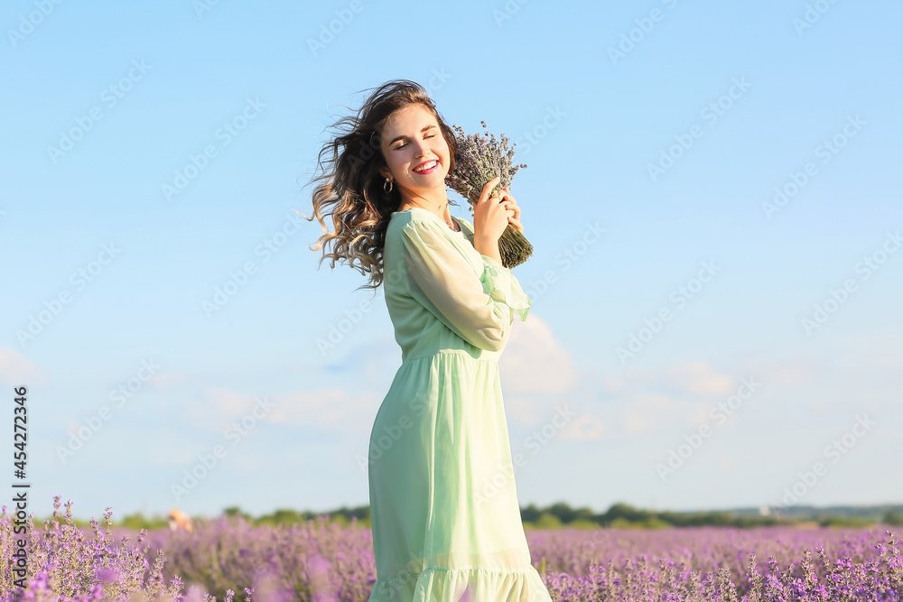 Beautiful young woman in lavender field