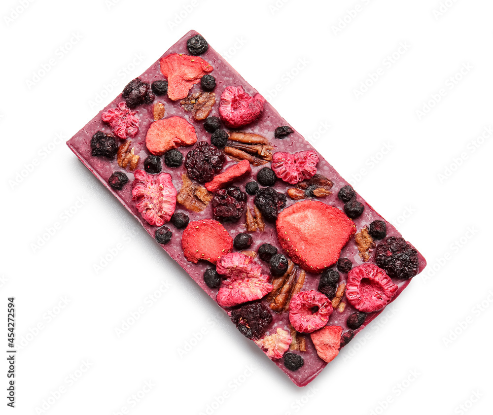 Handmade chocolate bar with fruits, berries and nuts on white background