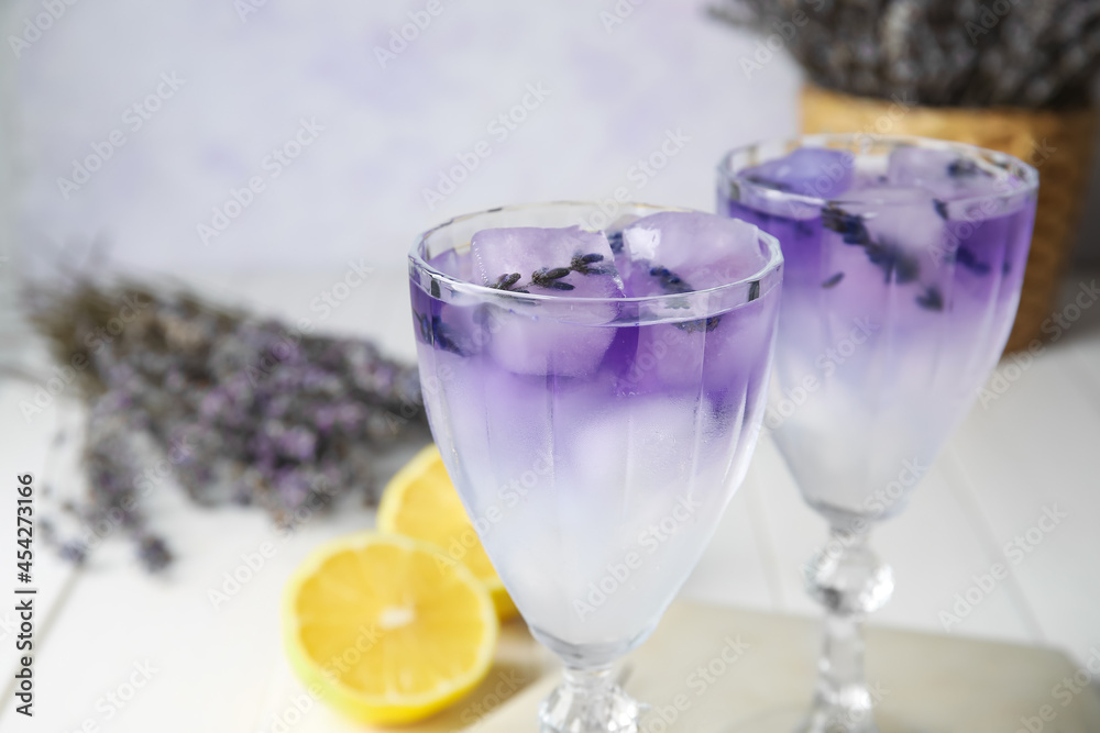 Glasses of fresh cocktail with lavender on table, closeup