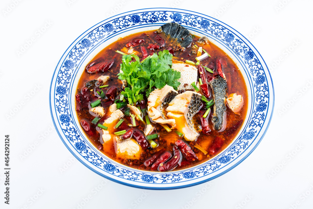 A large pot of boiled fish fillets on white background