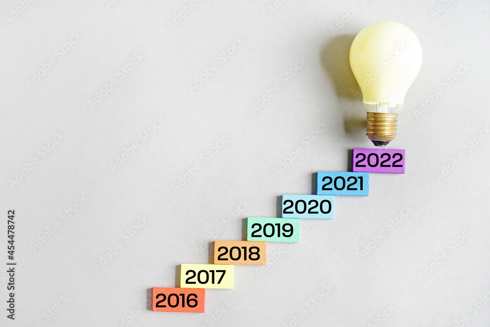 Figures denoting years 2016-2022 and light bulb on grey background