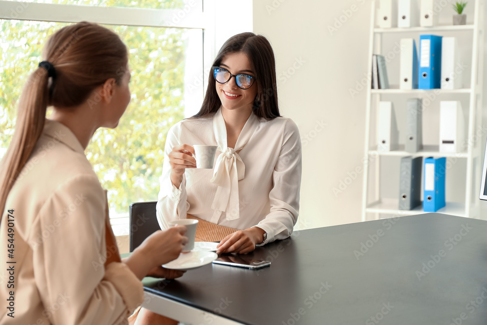 Business people having coffee break in office