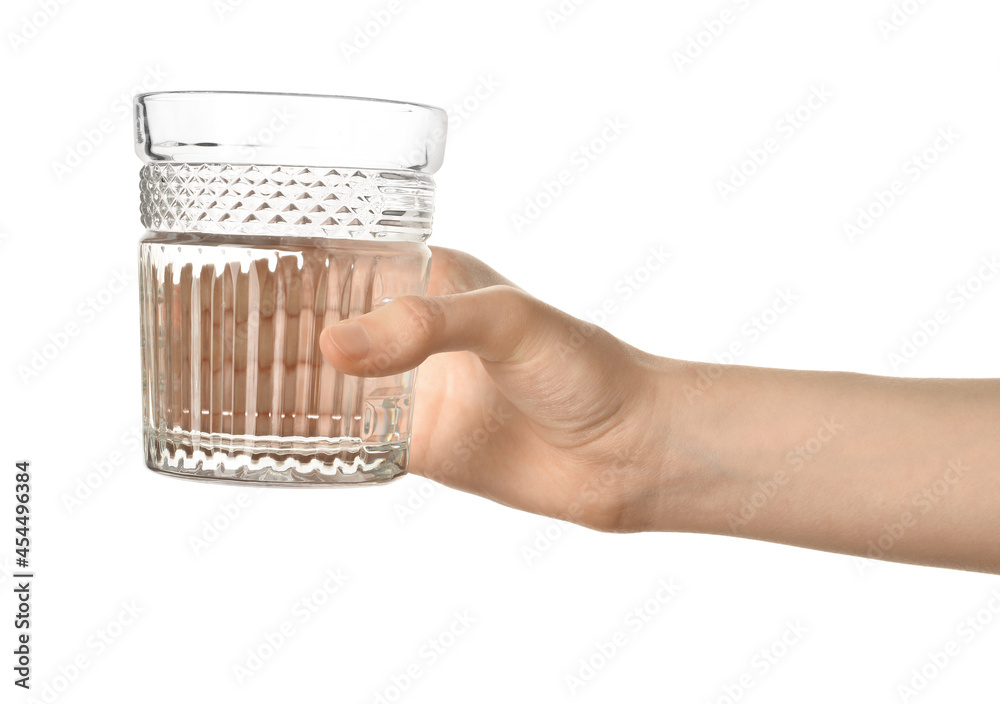 Female hand with glass of water on white background