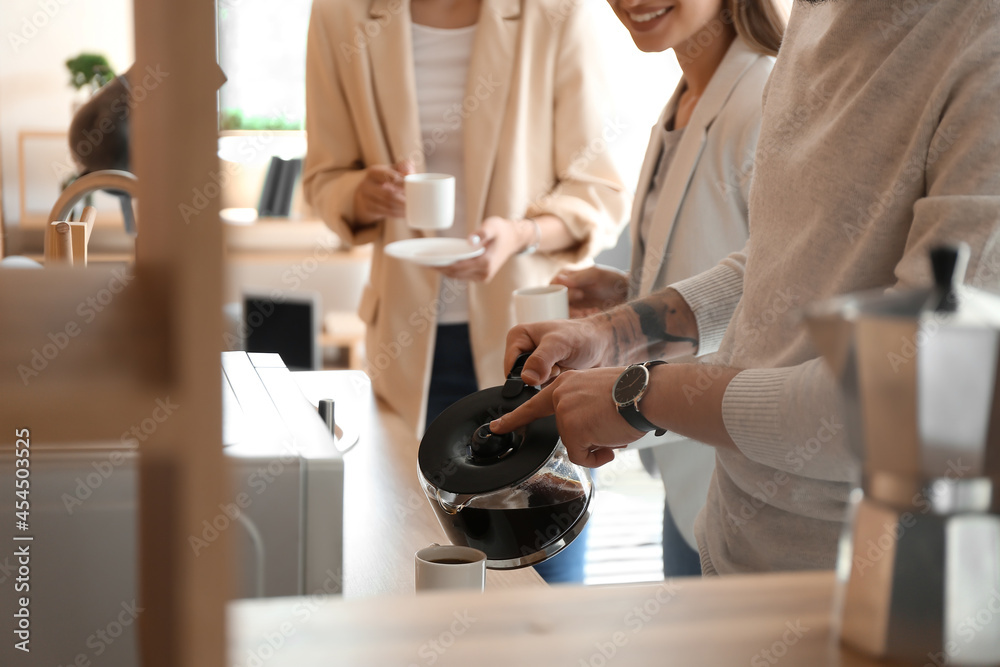 People having coffee break in office