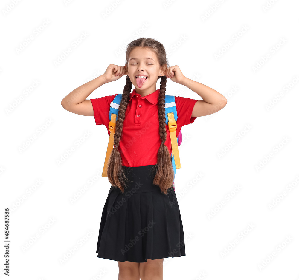 Cute grimacing schoolgirl on white background