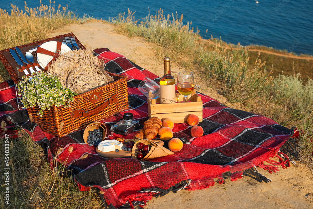 Tasty food and drink for romantic picnic outdoors