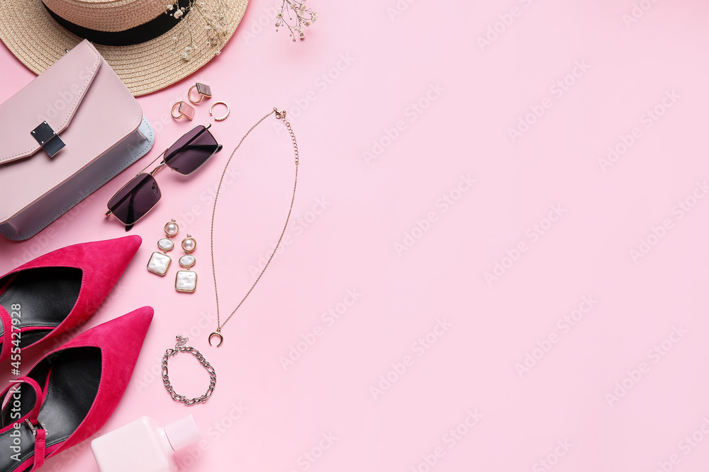 Set of female accessories with shoes on color background, closeup