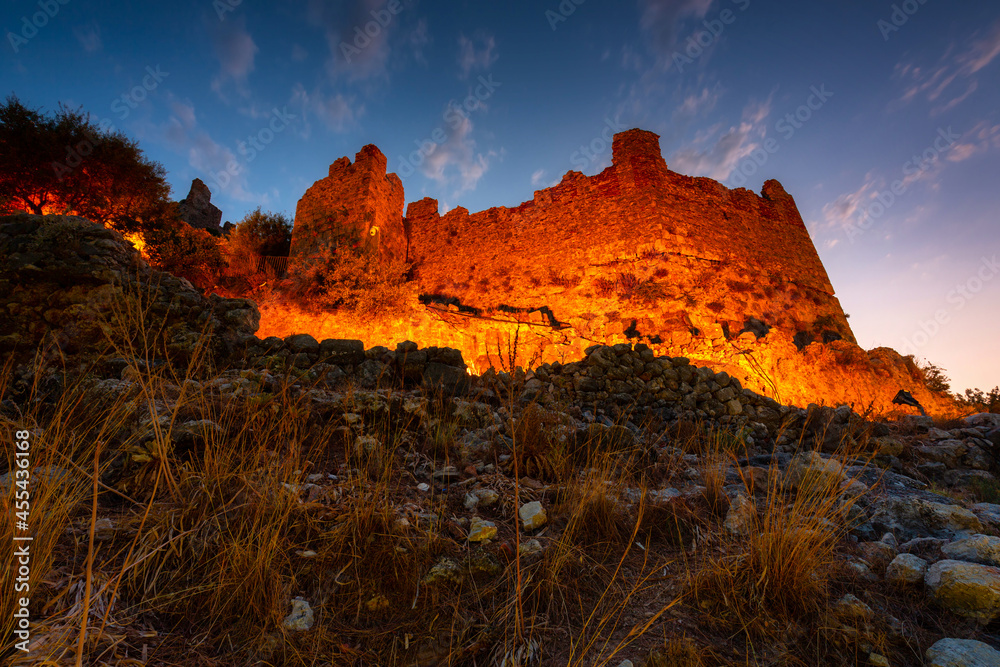 Beautiful castle on the hill in Alanya city at sunset. Turkey