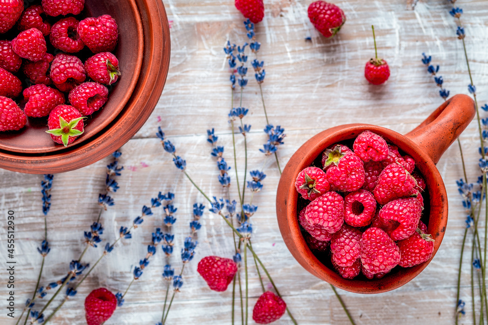 raspberry composition with dry lavender rustic background top view