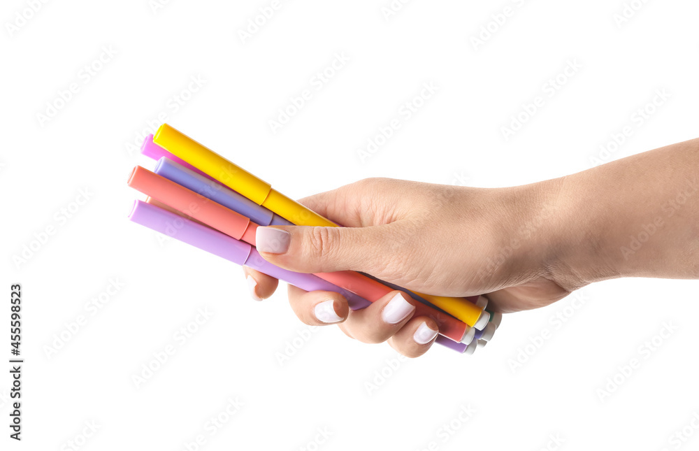 Woman holding different colorful markers on white background