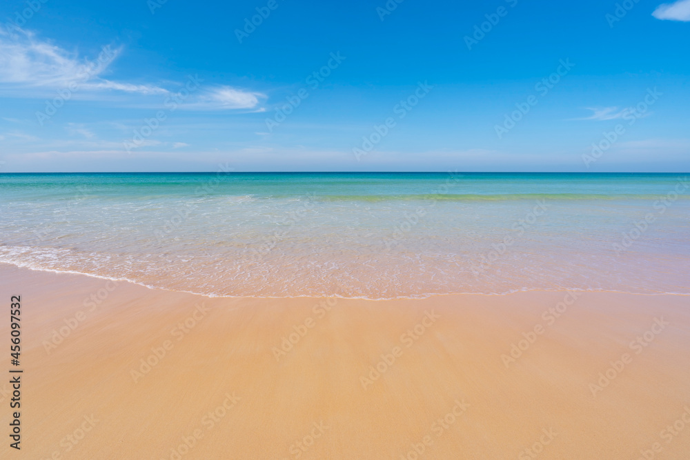 Tropical sandy beach with blue ocean and clear blue sky background image for nature background or su