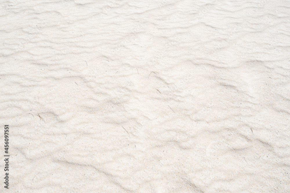 Detail of texture sand in tropical island Summer background and travel design.