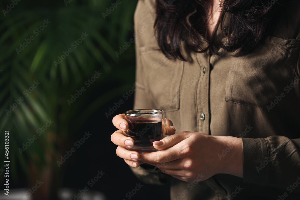 Woman with cup of hot turkish coffee, closeup