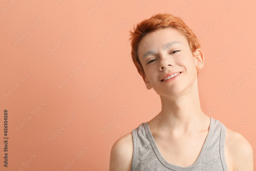 Teenage boy with dyed eyebrows on color background