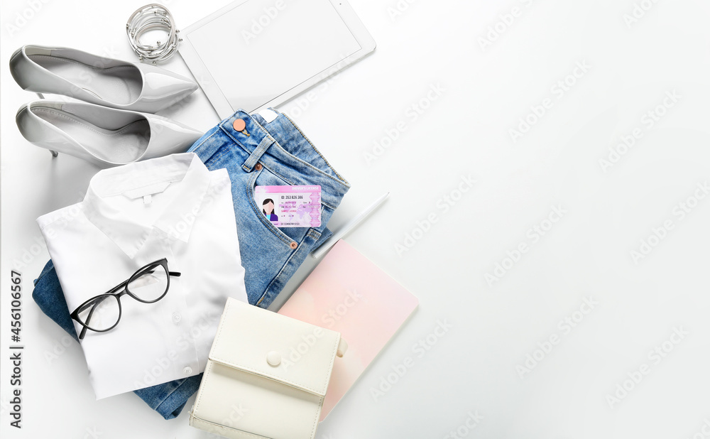 Female clothes and stylish accessories on white background