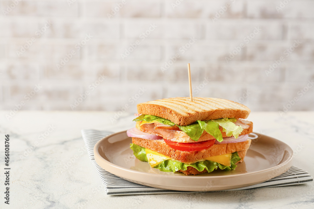 Plate with tasty sandwich on table, closeup