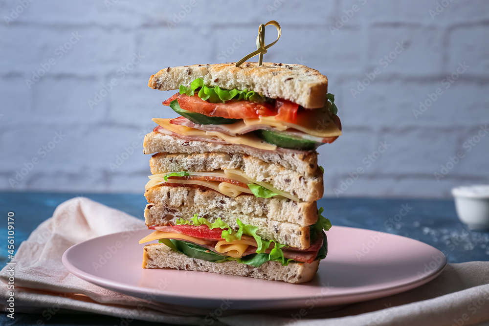 Plate with tasty sandwiches on table, closeup