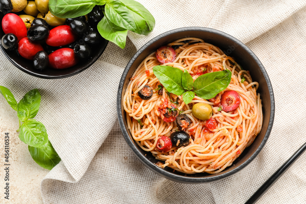 Bowl with tasty Pasta Puttanesca on table