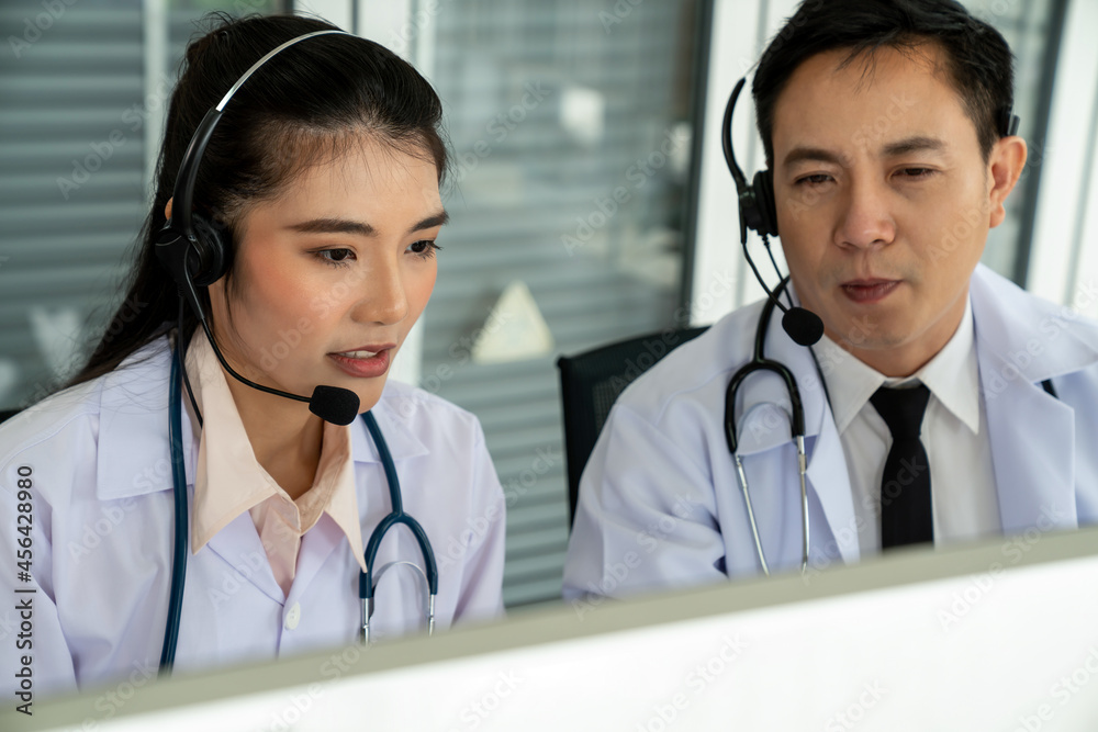 Doctor team wearing headset talking actively on video call in hospital clinic . Concept of telehealt