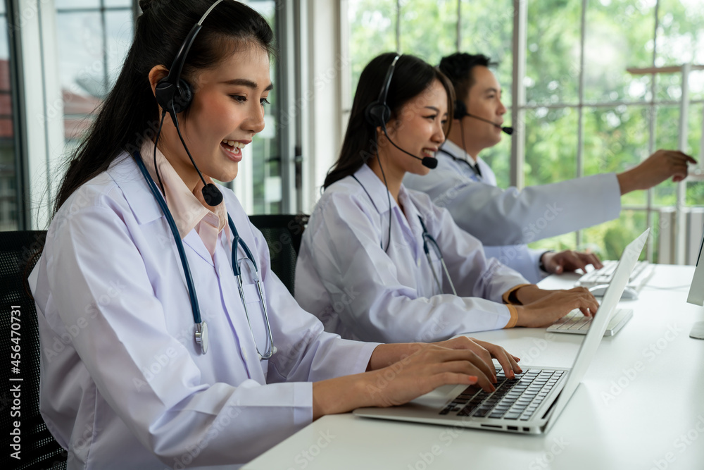 Doctor team wearing headset talking actively on video call in hospital clinic . Concept of telehealt