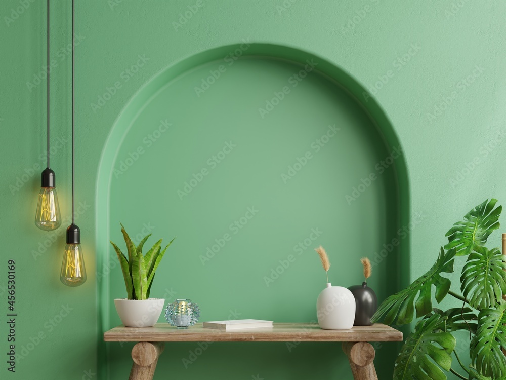 Interior wall mockup,Green wall and wooden table.