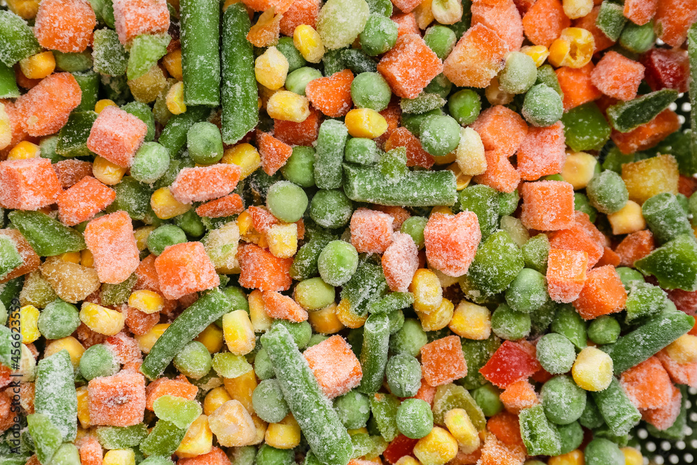 Different frozen vegetables as background, closeup