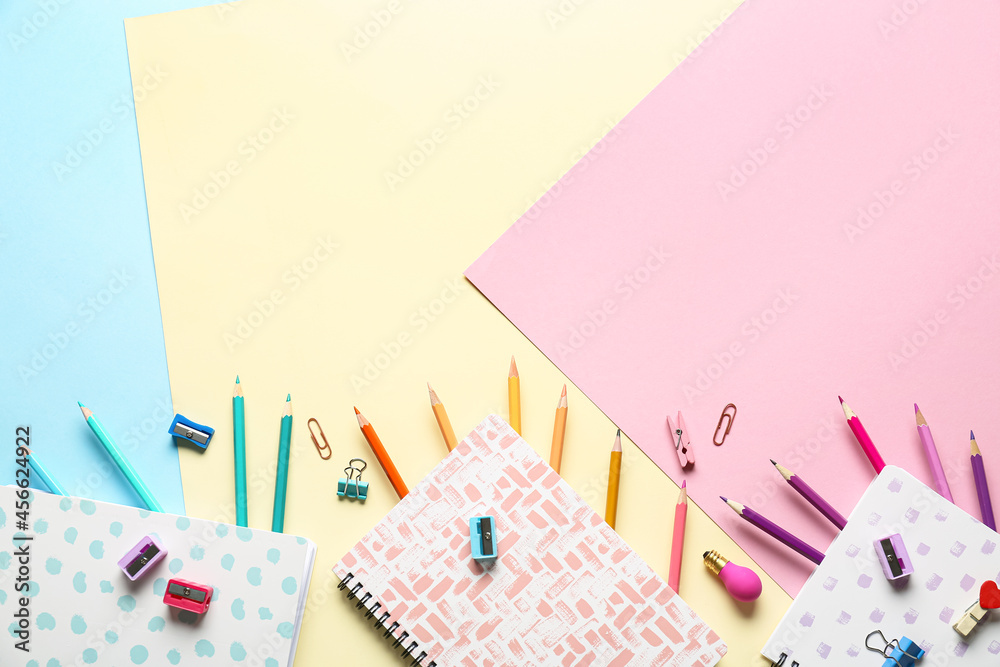 Stationery supplies on color background