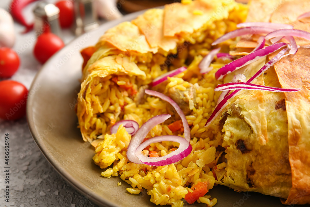 Plate with tasty Shah Pilaf on table, closeup