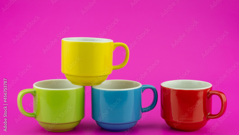 Colorful coffee cup on colorful paper background A lot of cups for coffee and tea in coffee shop Foo