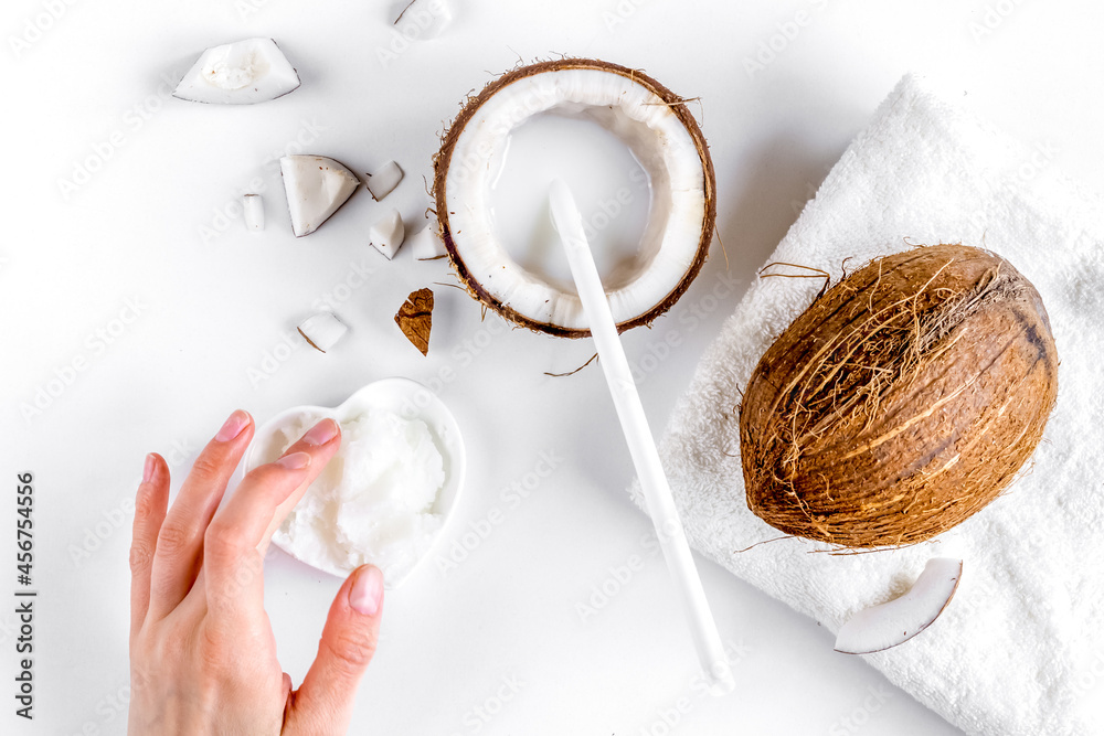 organic cosmetics with coconut on white background top view