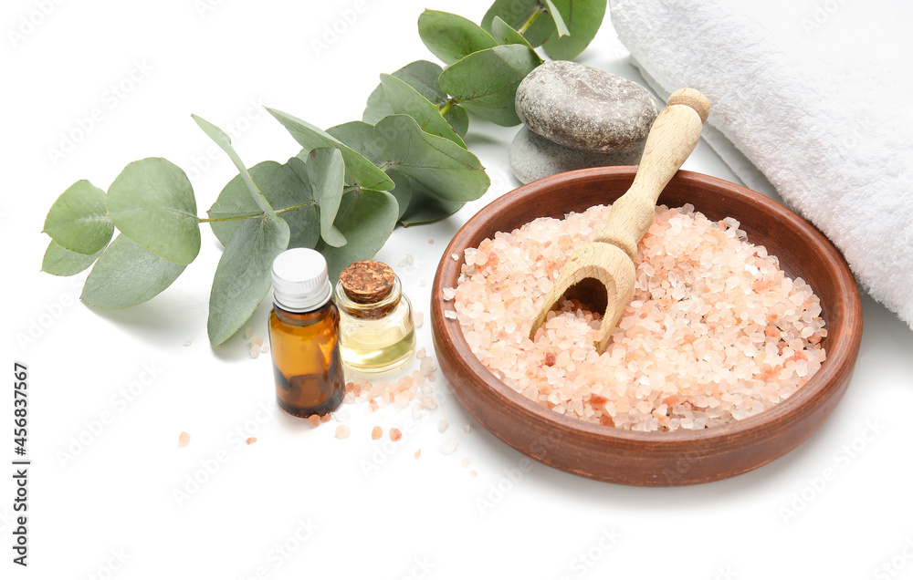 Beautiful spa composition with eucalyptus branch on white background