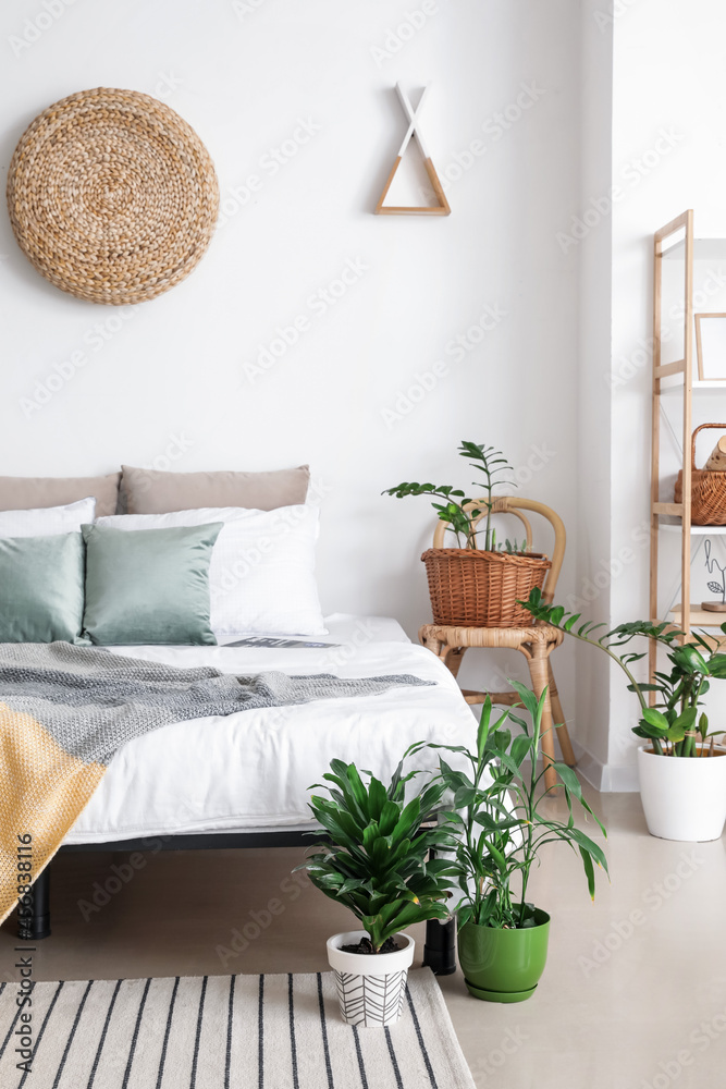 Interior of stylish bedroom with plants