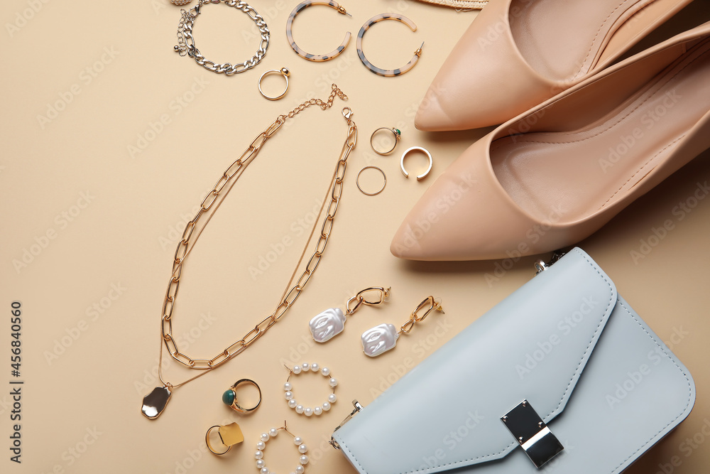 Set of female accessories and shoes on color background, closeup