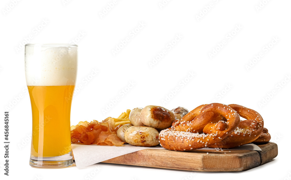 Glass of beer, sausages and pretzels on white background. Oktoberfest celebration