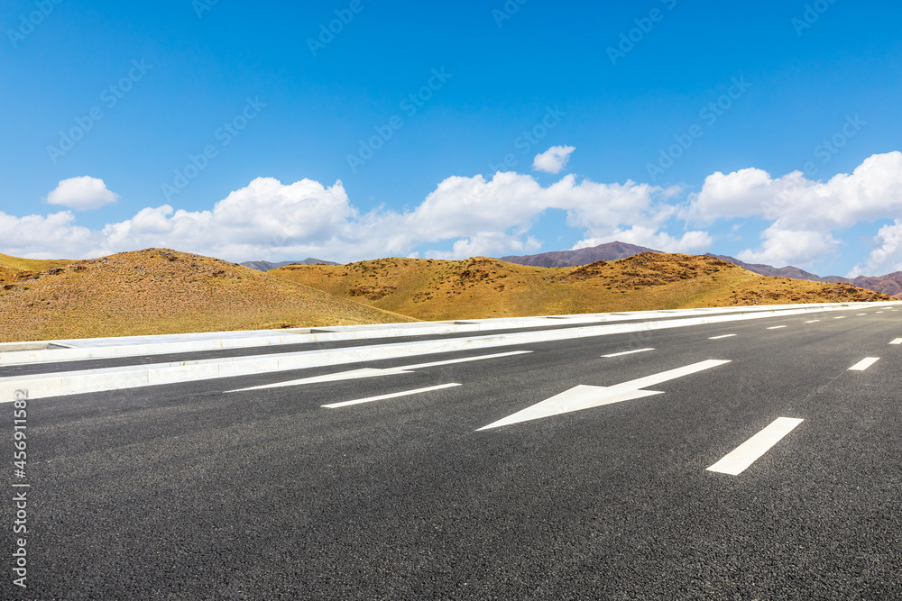 Highway ground and mountain natural scenery under blue sky.Landscape and highway.Outdoor road backgr