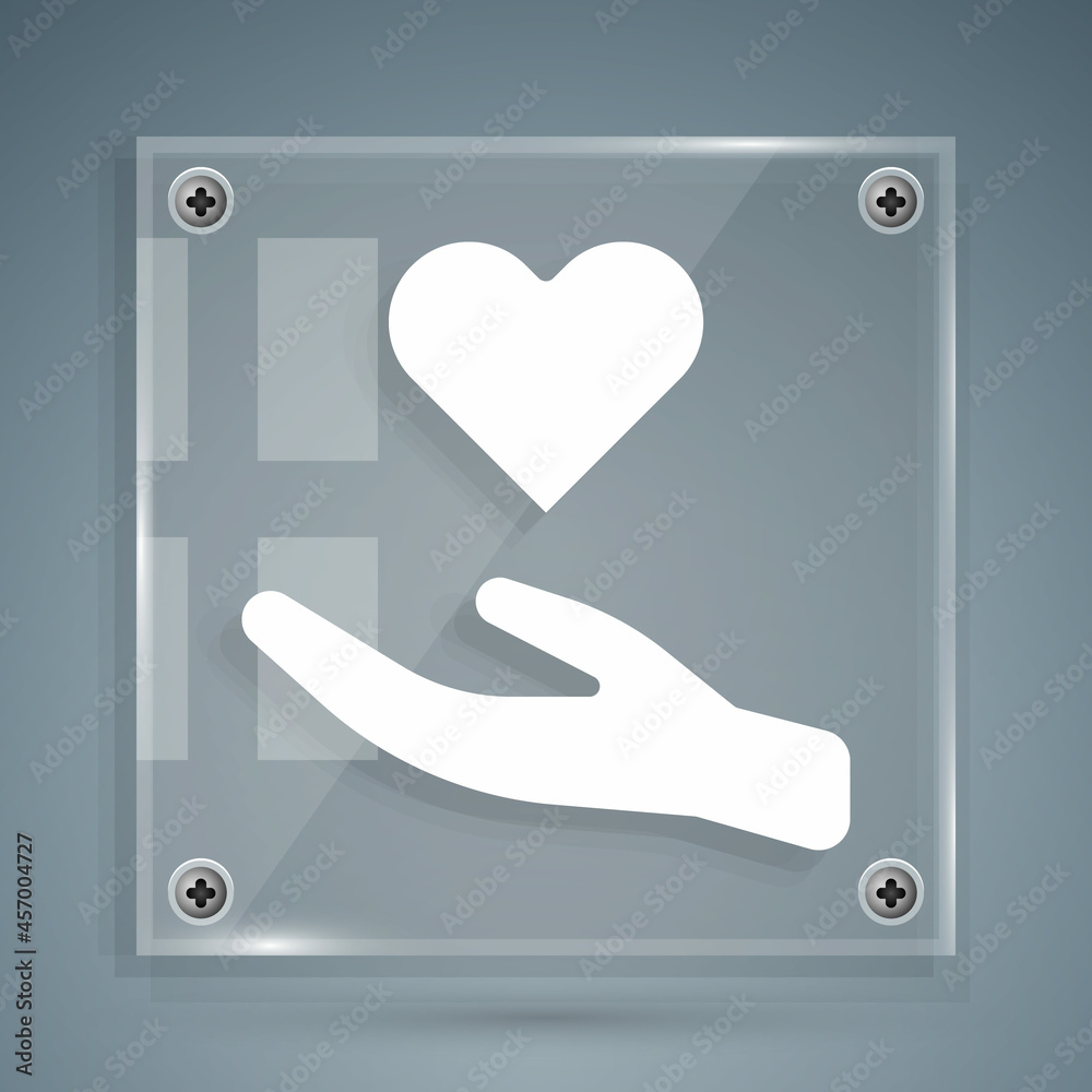 White Heart in hand icon isolated on grey background. Hand giving love symbol. Valentines day symbol