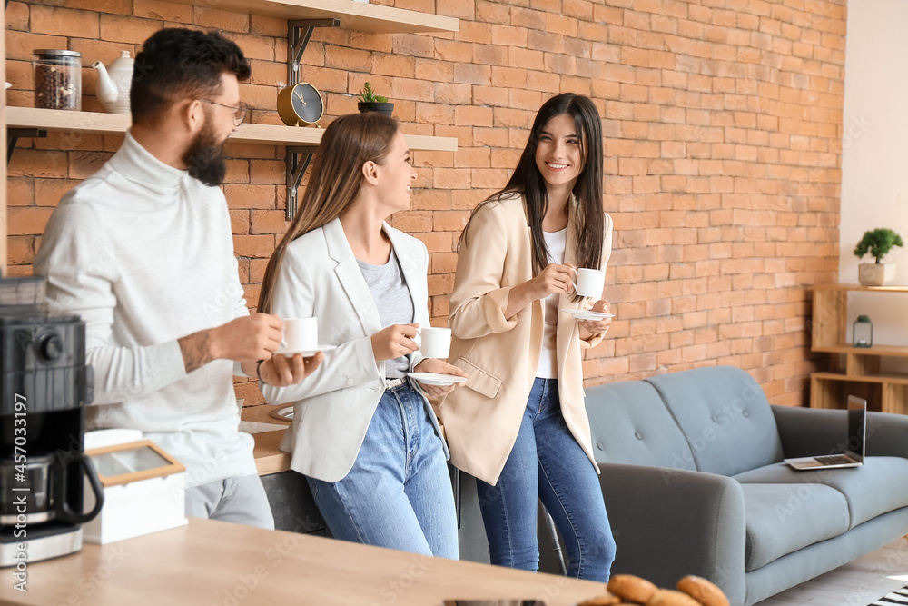 People having coffee break in office