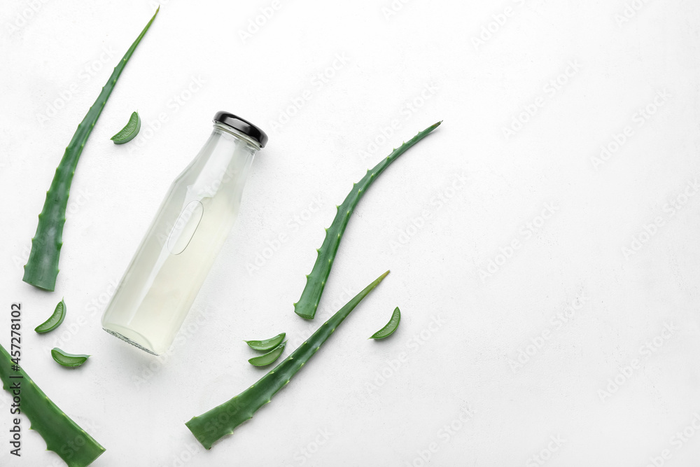 Bottle of healthy aloe juice on white background