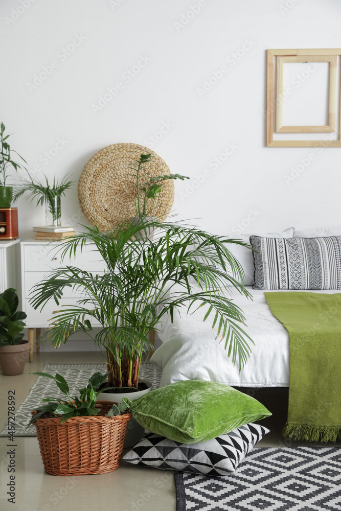 Interior of stylish bedroom with plants