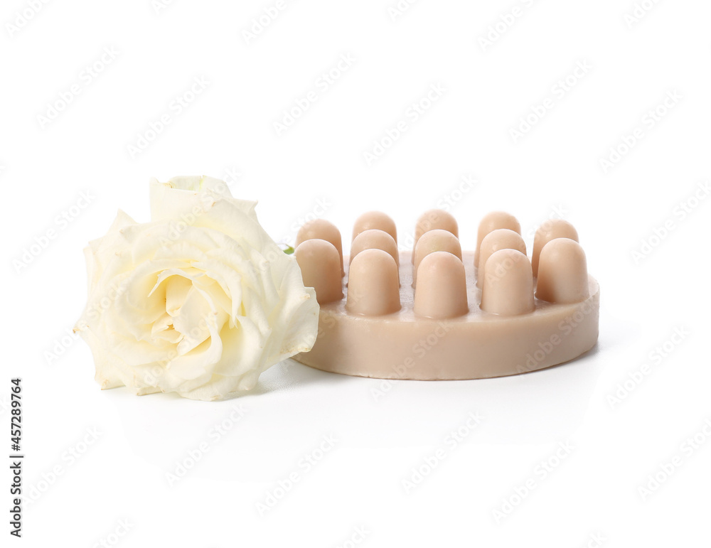 Massage soap bar and rose flower on white background