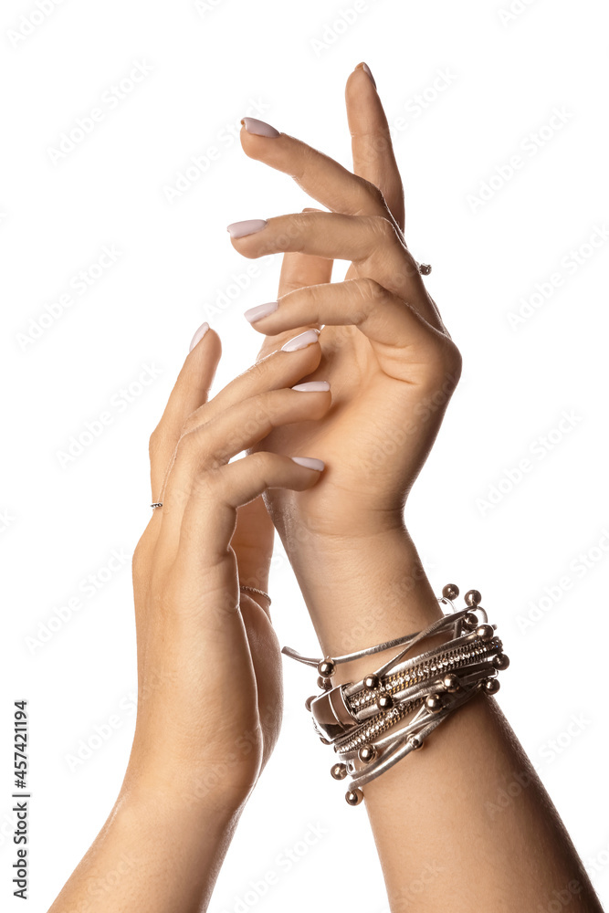 Woman with beautiful manicure and stylish jewelry on white background