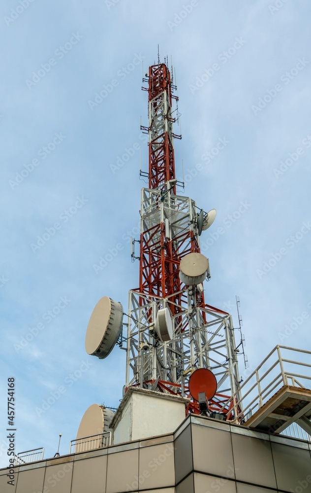 Large telecommunication tower against sky and clouds in background . Internet network connection con