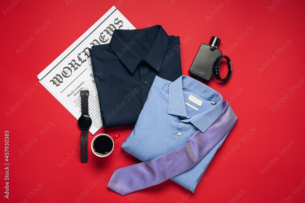 Stylish male clothes, accessories and smartwatch on color background