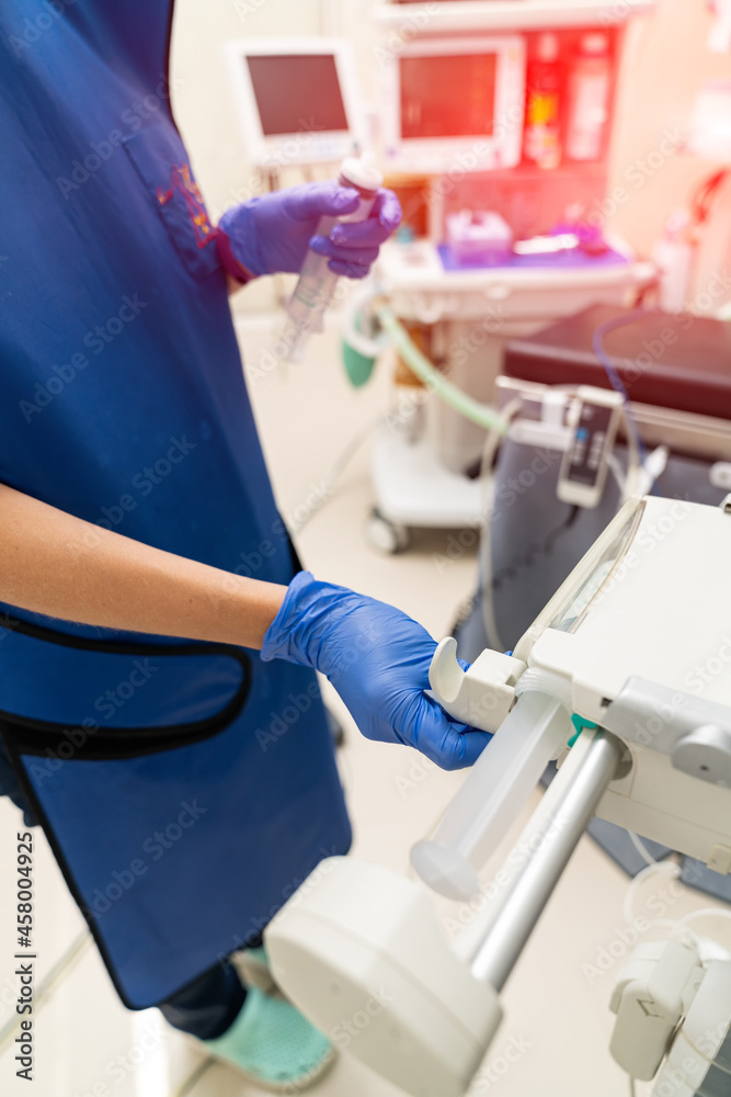 Healthcare medical specialist working with new technology. Man in surgical protective uniform.